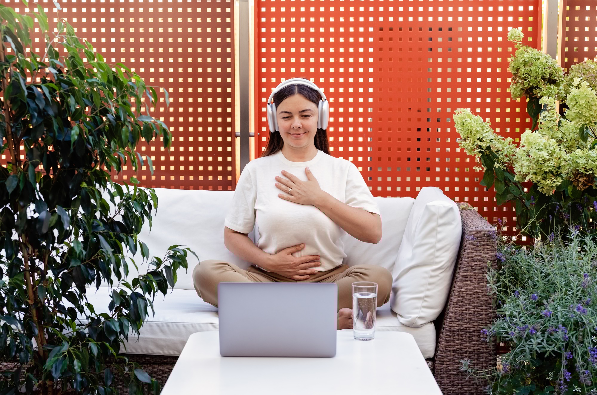 Young woman having online theta holistic healing session and breathing practices